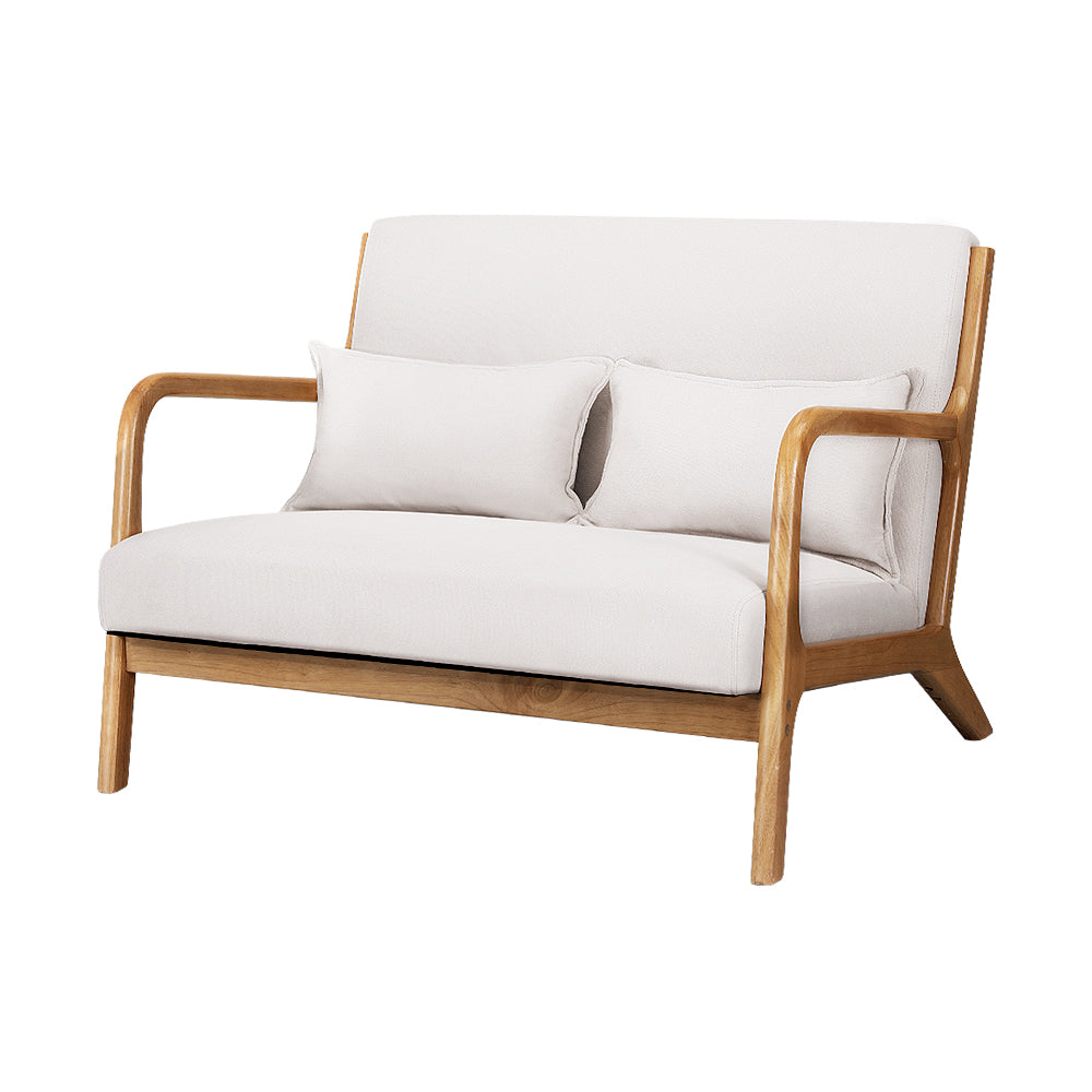 Cream fabric two-seater loveseat with natural rubberwood frame, two cushions, three-quarter angle view on white background