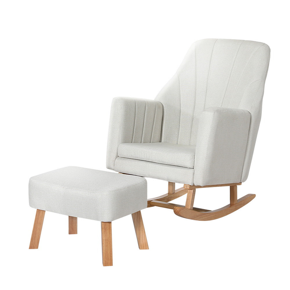 Cream fabric rocking chair with fan-stitched backrest and matching ottoman, natural wood rocking base, three-quarter view