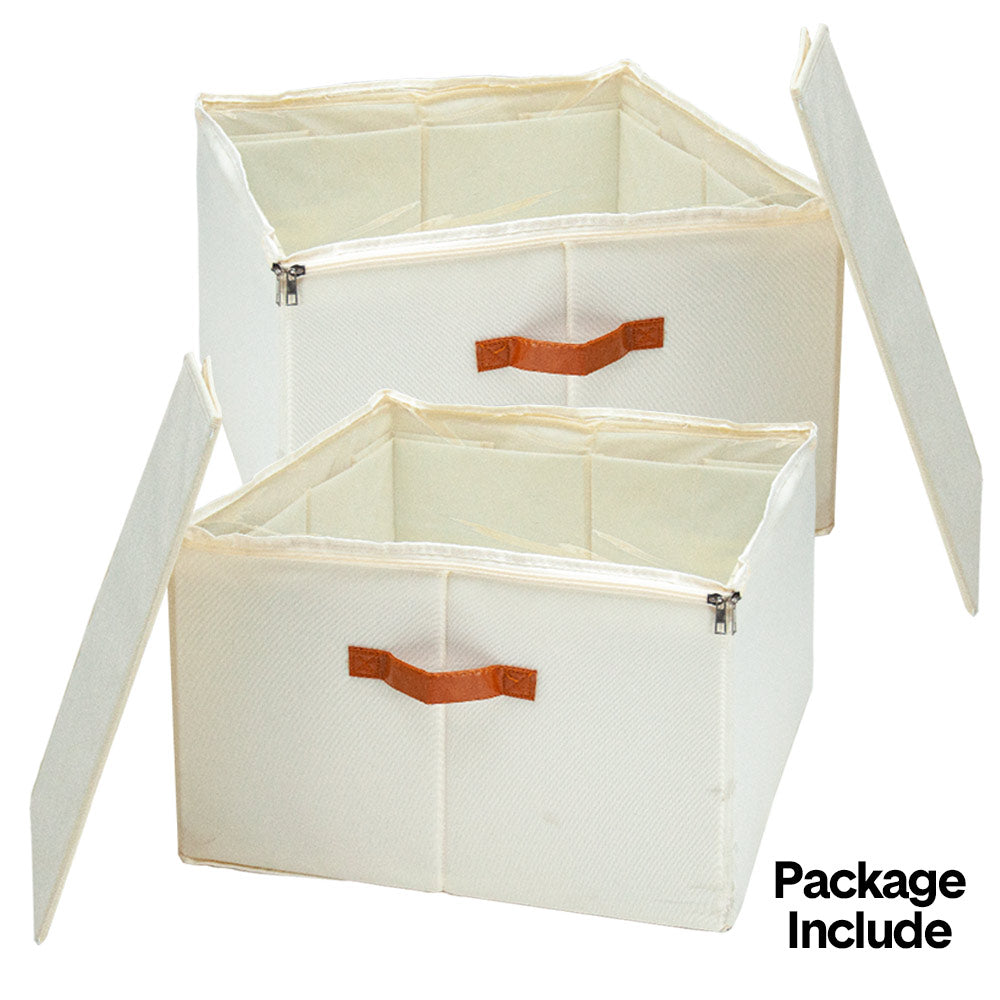 Two cream fabric shoe storage boxes open with lids showing internal dividers and orange leather handles on white background