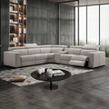 Cream leather L-shaped sectional recliner sofa in dark-toned living room with one footrest extended