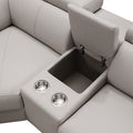 Close-up of cream leather recliner sofa centre console with open storage box and two steel cup holders
