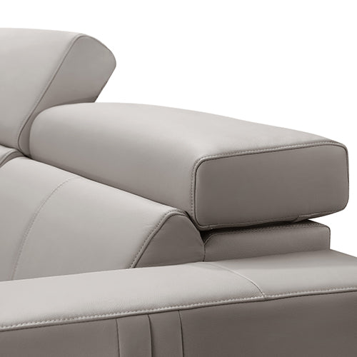 Close-up of cream leather recliner sofa adjustable articulating headrest with stitched upholstery detail