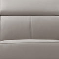 Close-up of cream leather recliner sofa backrest surface showing two-panel stitched upholstery