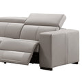 Close-up of cream leather recliner sofa end seat with footrest extended showing recliner mechanism