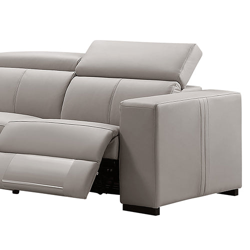 Close-up of cream leather recliner sofa end seat with footrest extended showing recliner mechanism