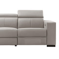 Close-up of cream leather recliner sofa end seat section showing padded headrest and seat cushion