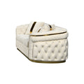 Elevated rear-angle view of cream velvet chesterfield loveseat showing tufted back and gold trim on white