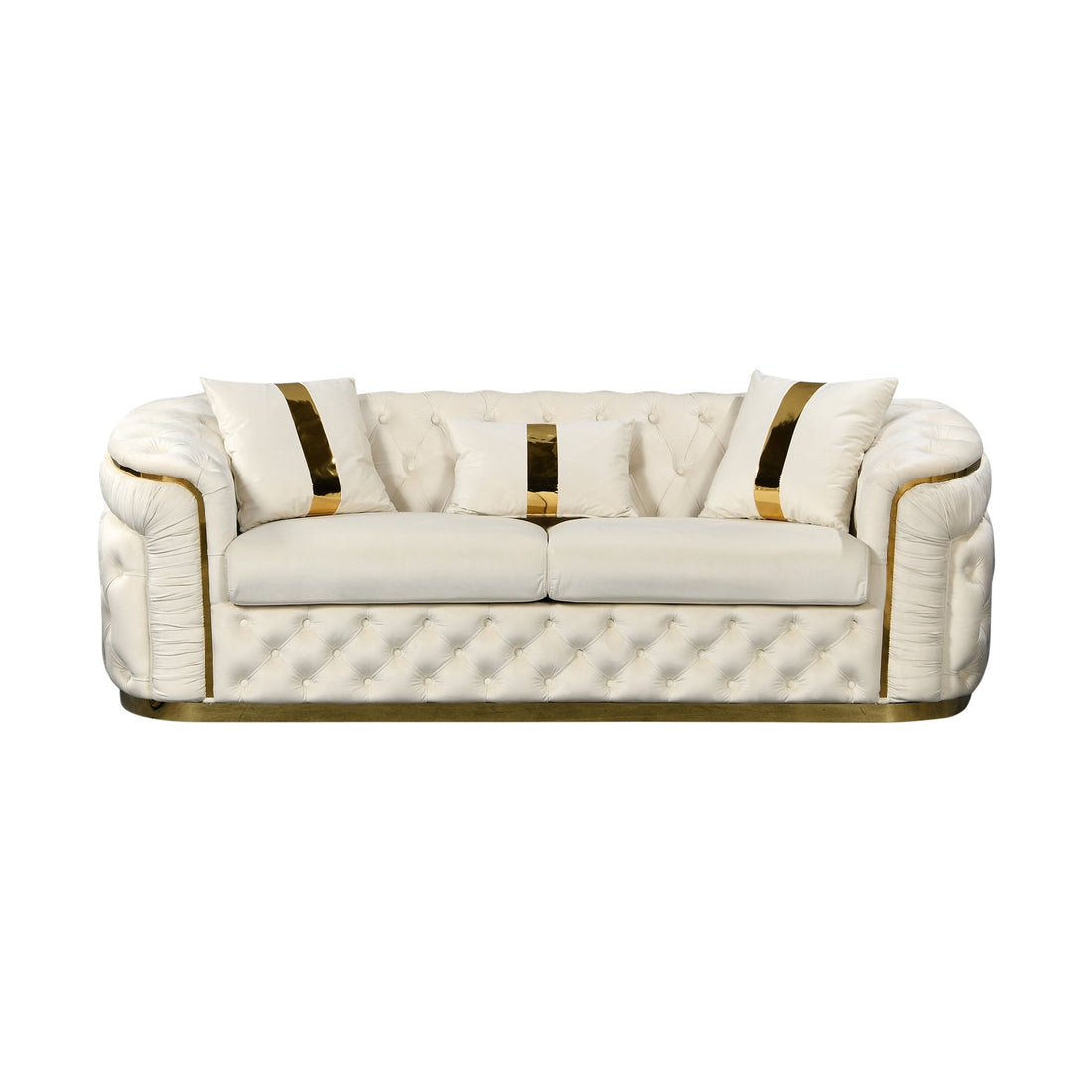 Cream velvet chesterfield 3-seater sofa with gold accents and throw pillows in opulent white living room