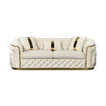 Cream velvet chesterfield 3-seater sofa with gold-striped pillows and button tufting on white background