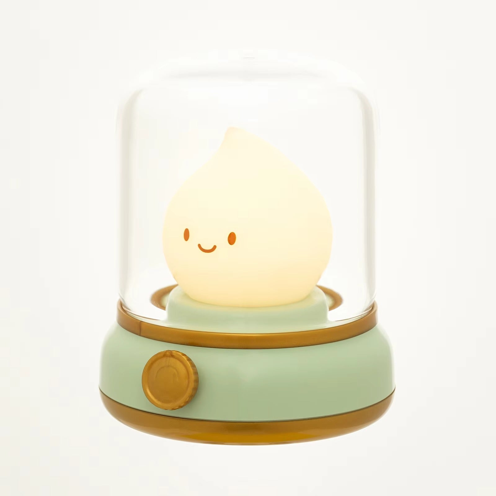 Smiley face raindrop LED lamp in glass dome on mint green base with gold trim and rotary knob on white background