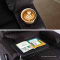 Dark brown PU recliner detail: cup holder with latte (top) and swivel tray table with open magazine (bottom)