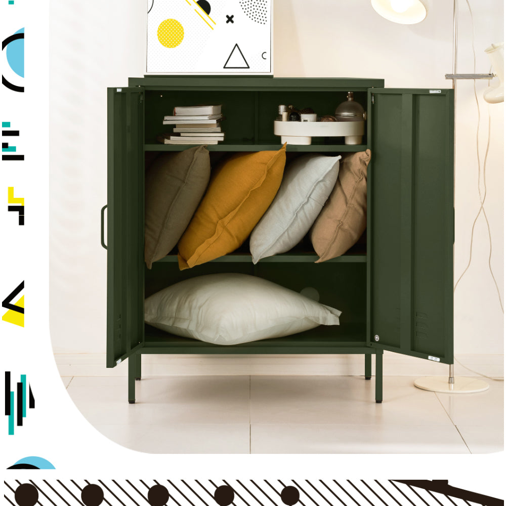 Dark green two-door locker cabinet open with shelves storing coloured cushions, books and a tray