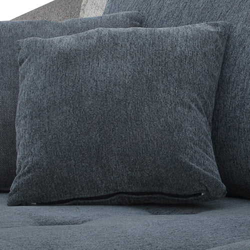 Close-up of dark grey chenille throw pillow on sofa seat showing woven fabric texture