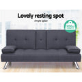 Dark grey fabric sofa bed in room showing 200kg capacity badge, tufted back and chrome legs