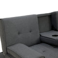 Close-up of dark grey sofa bed split backrest section with cup holder visible beside tufted seat