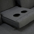 Close-up of dark grey sofa bed fold-down centre console showing two black cup holder rings