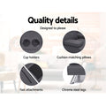 Dark grey fabric sofa bed quality details: two cup holders, matching cushion pillows, chrome steel legs