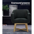 Dark charcoal tub armchair in dark lifestyle room with plant, text: Enamoured presence, A perfect fit in every way
