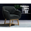 Dark charcoal fabric tub armchair in dark lifestyle room, angle view, text: Premium fabric, Smooth and soft