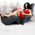 Dark grey velvet floor lounger with foldable headrest and armrests, upright position, angle view on white background