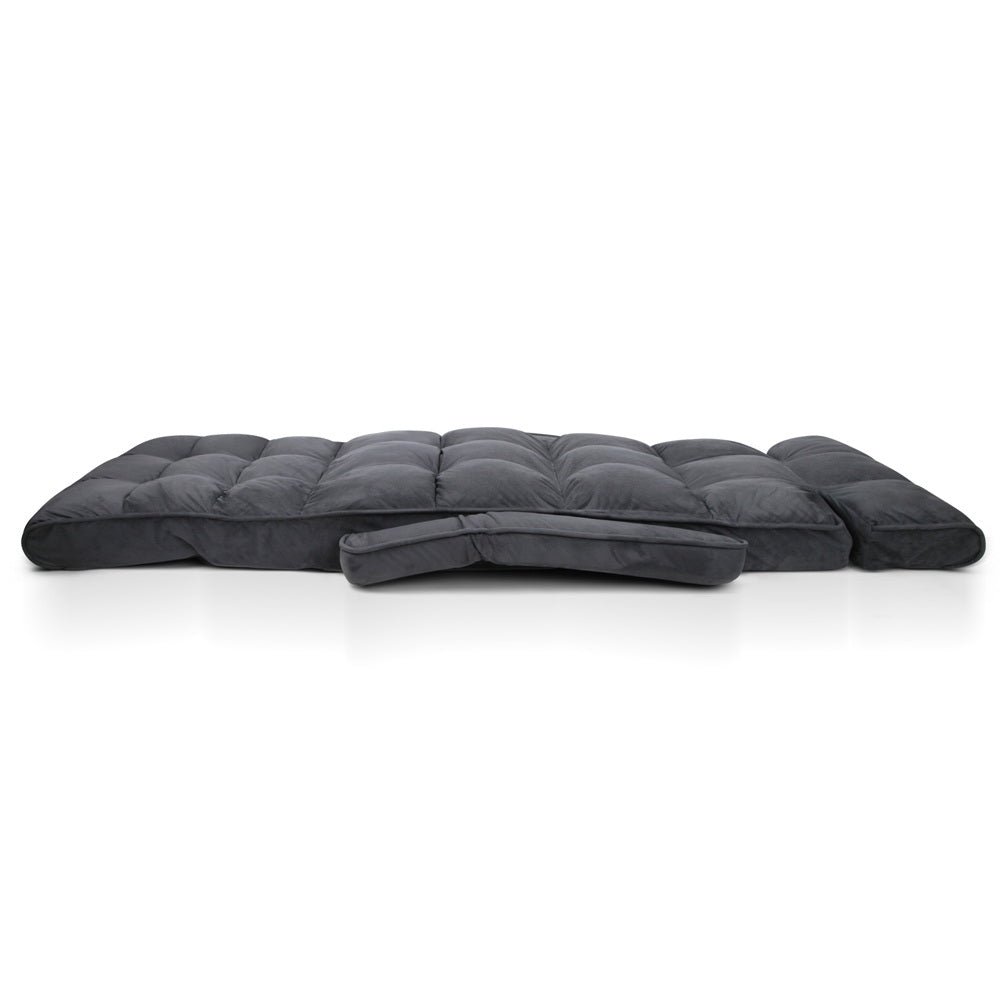 Dark grey floor lounger: 5 backrest positions shown with insets: Reading, Watching TV, Sleeping, text: Adjustable backrest