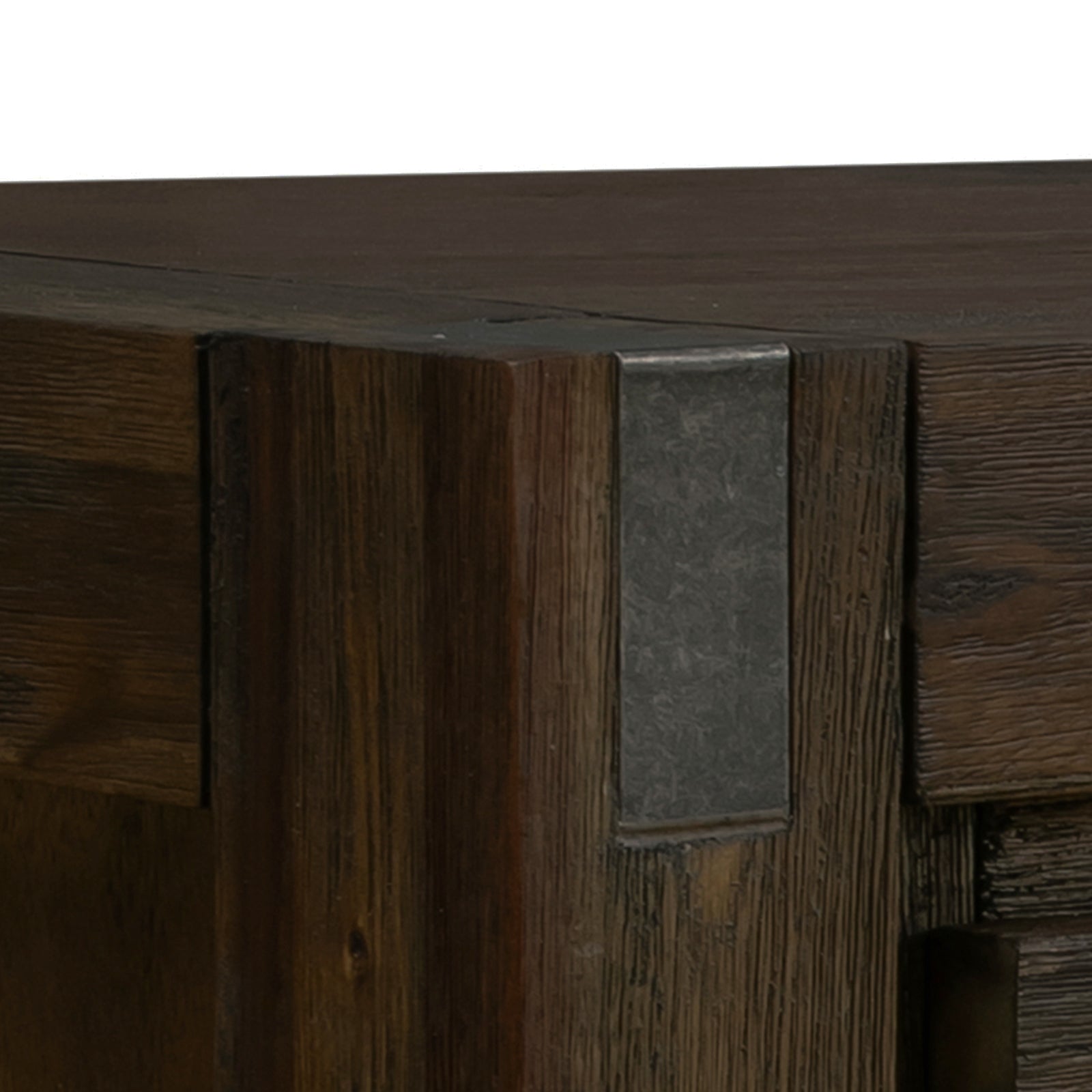 Close-up of dark wood sideboard top left corner showing large rectangular metal bracket and grained wood texture