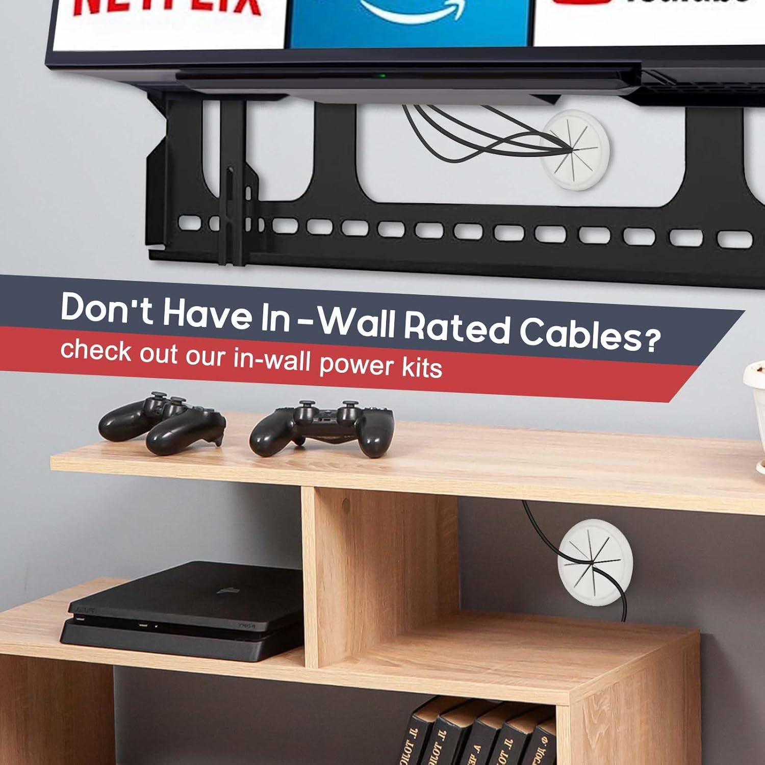 White cable grommet in wall-mounted TV bracket setup gaming controllers and PS4 shelf below in-wall cable routing shown