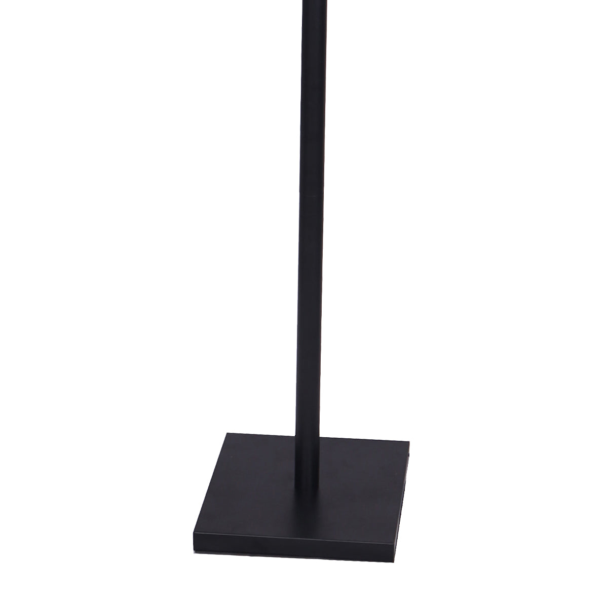 Close-up of flat black square metal base of dual-arm floor reading lamp with black pole on white background