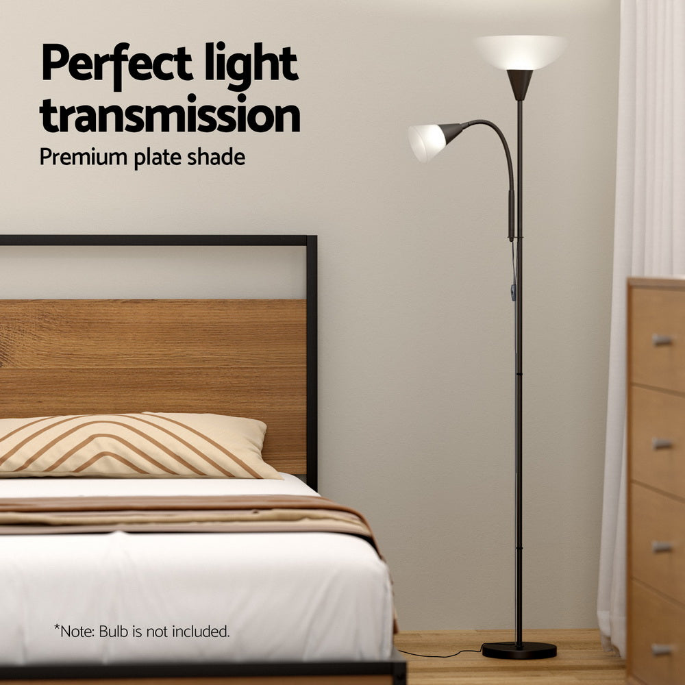 Black dual-shade floor lamp in bedroom scene with wooden headboard and text overlay perfect light transmission