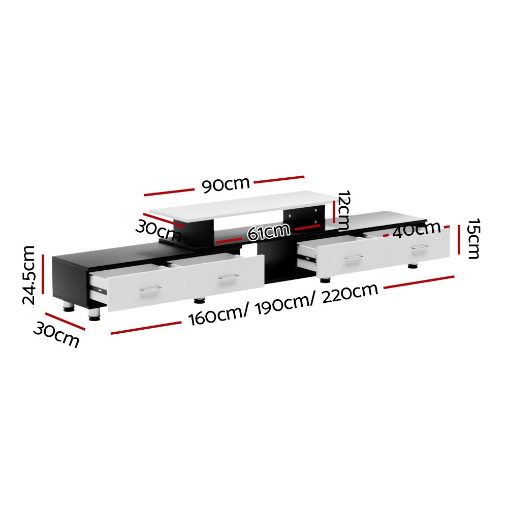 Black and white extendable TV unit 160cm option in living room with wall-mounted TV and silver media player on shelf