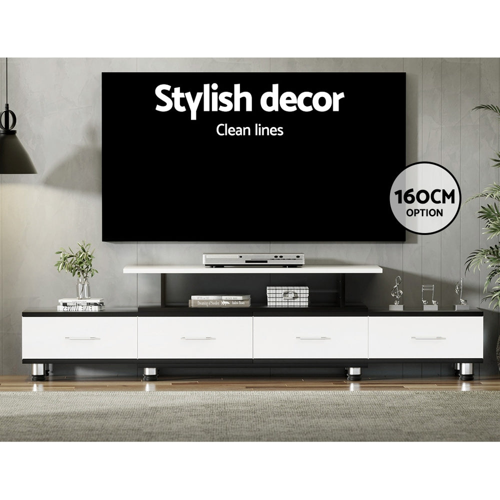Black and white extendable TV unit 160cm option in living room below wall-mounted TV with clean minimal styling