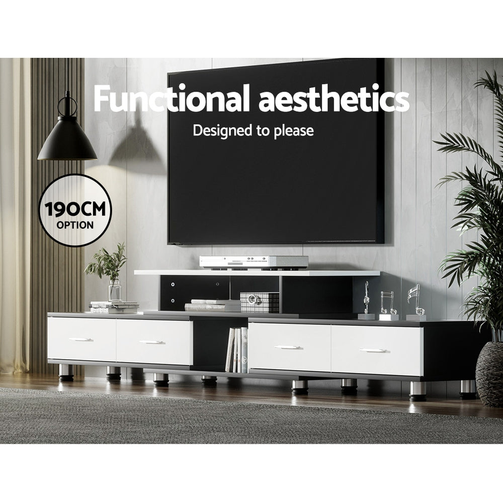 Black and white extendable TV unit 190cm option in living room below wall-mounted TV with black pendant lights
