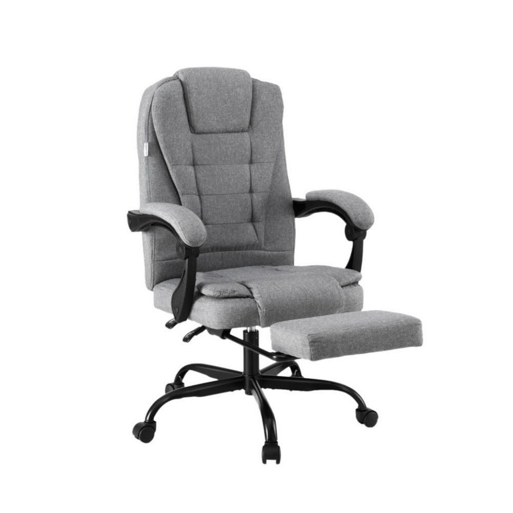 Grey fabric high-back recliner executive chair with chrome base in grey-panelled lifestyle room with wood floor