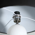 Underside view of dark grey drum shade, white interior lining, chrome E27 Max.60W socket, white cord and glass ball below