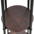 Close-up of round dark walnut-finish shelf on black metal poles, part of a multi-tier floor lamp stand