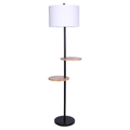 Floor lamp with two round wood shelves on black metal pole, white drum shade on top and round black base, white background