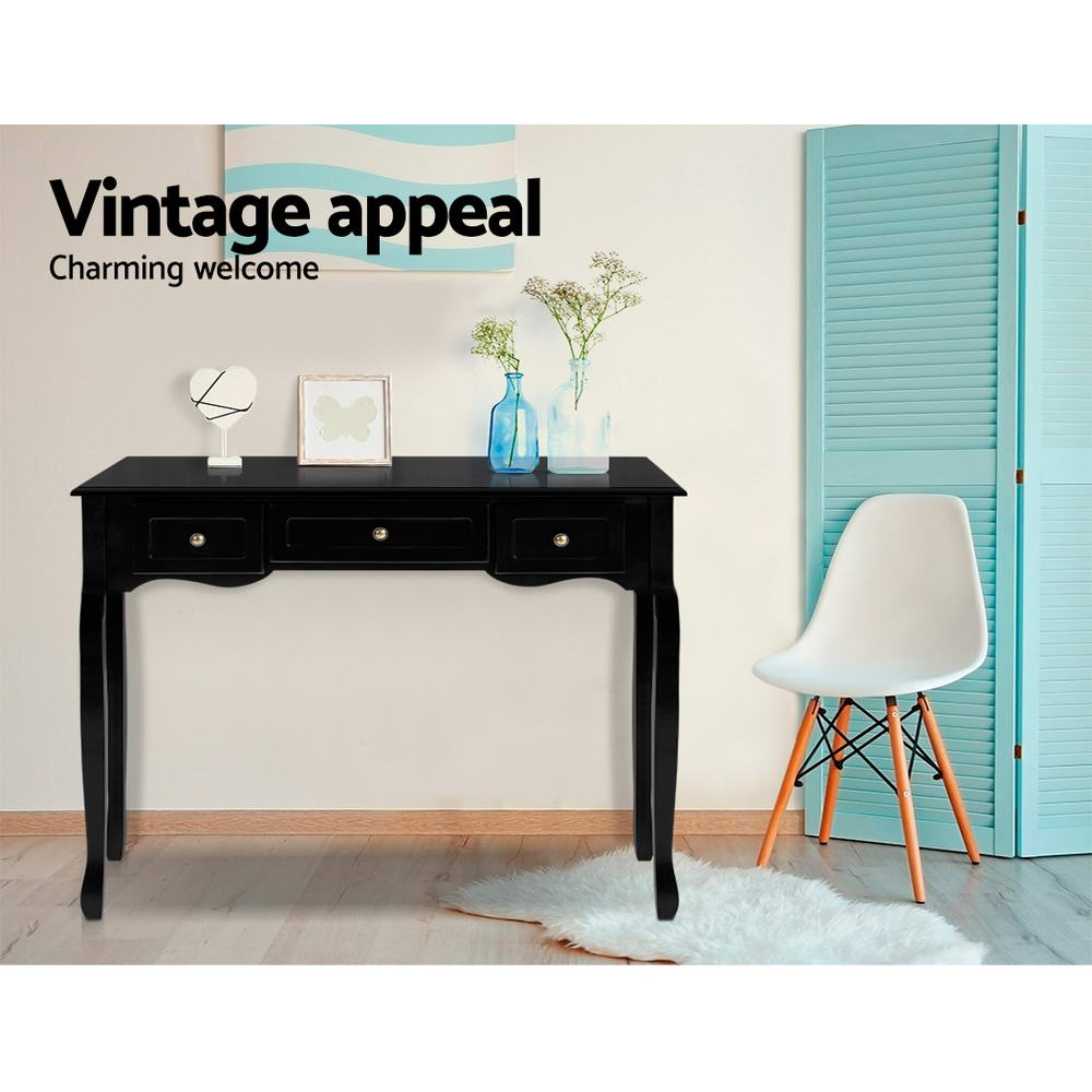 Black French provincial console in room with blue vases and Eames chair; teal screen beside; text "Vintage appeal"