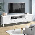 White French provincial TV stand 160cm below wall-mounted TV in grey-blue room with grey sofa and vases