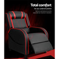 Black and red gaming recliner footrest fully extended with total comfort infographic on dark dramatic background