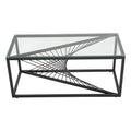 Rectangular clear glass-top coffee table with black metal starburst wire base on white background, three-quarter angle view