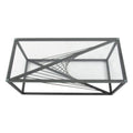Top-down view of rectangular clear glass-top coffee table showing black metal starburst wire base pattern visible through