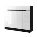 Black framed shoe cabinet with 4 high-gloss white doors and 2 top drawer pulls on white background