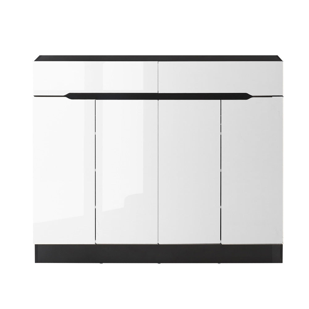 Black framed shoe cabinet 4 high-gloss white doors all closed and 2 top drawers front view on white bg