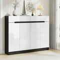 Black framed shoe cabinet 4 white high-gloss doors and 2 top drawers in room with plant