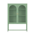 Sage green metal sideboard with two arched mesh door panels and gold round knobs, direct front view on white background