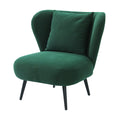 Green corduroy wingback chair with throw pillow, wide curved wings and black tapered legs, angle view on white background