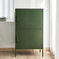 Dark green metal two-compartment locker cabinet with stacked doors and vent slots in lifestyle room setting