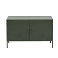 Dark green metal two-door locker-style cabinet with vent slots and matching handles on thin metal legs on white background