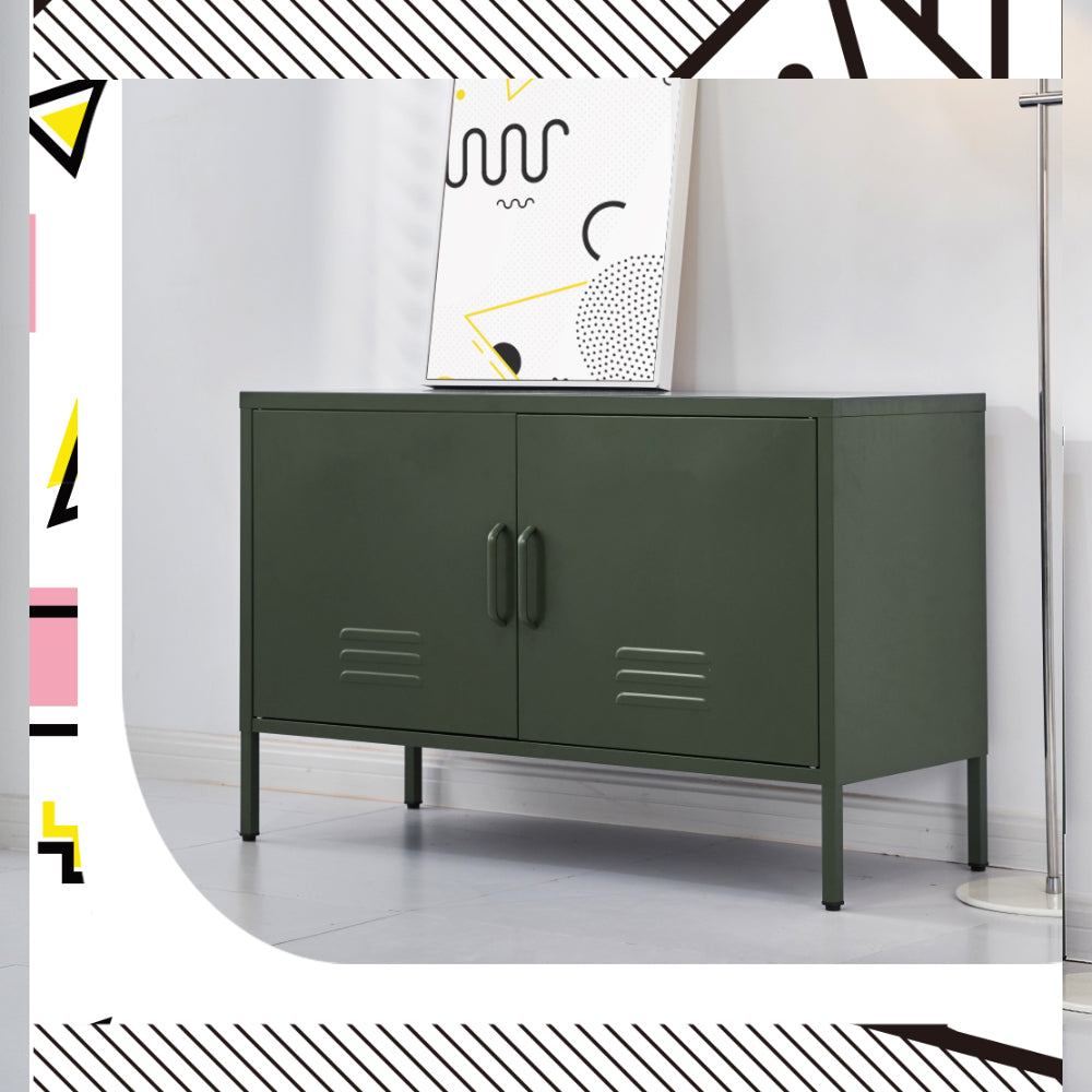 Green metal two-door locker cabinet with vent slots and bar handles in lifestyle room setting with abstract art poster behind