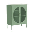 Sage green metal sideboard with circular mesh door panels, D-ring handles and metal legs, three-quarter angle on white
